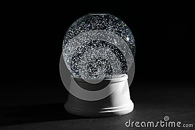 Magical empty snow globe on dark Stock Photo