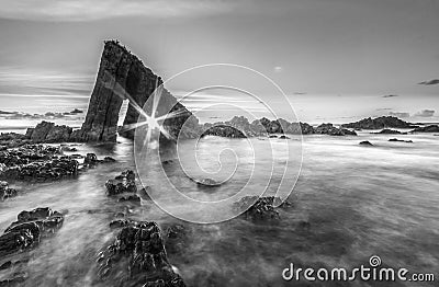 Magical monolith in Asturian beach Stock Photo