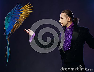 Magician man in stage costume Stock Photo