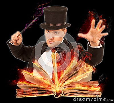 Magician with opened burning book Stock Photo