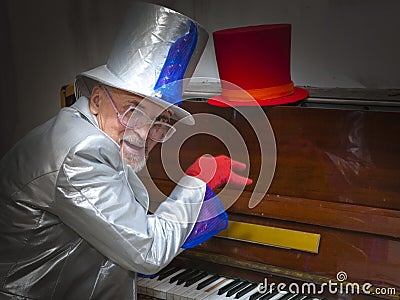 Magician playing the piano Stock Photo