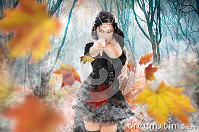 Magician witch power girl. Superpowers dark sorceress woman. Fall foliage forest. Stock Photo