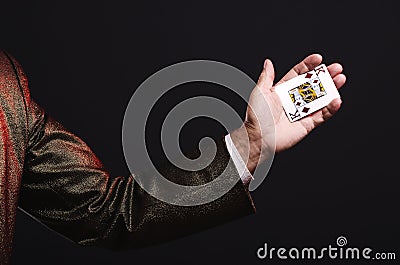 Magician shows trick with playing cards. Manipulation with props Stock Photo