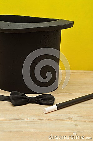 A magicians hat , wand and bow tie Stock Photo