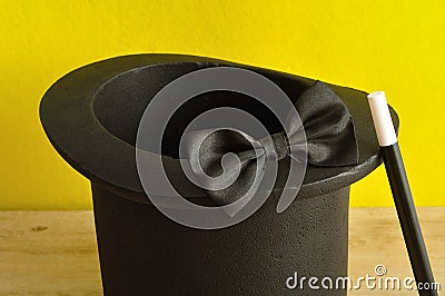 A magicians hat , wand and bow tie Stock Photo