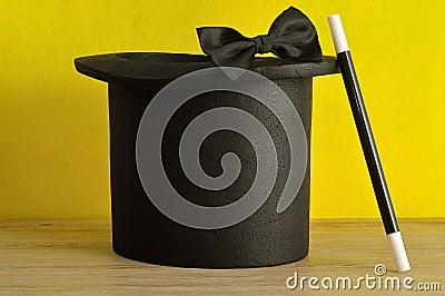 A magicians hat , wand and bow tie Stock Photo