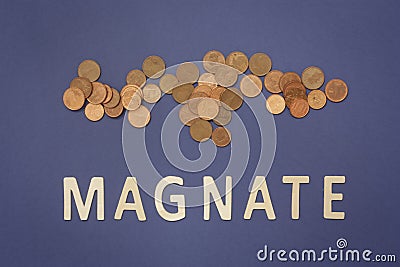 Magnate written with wooden letters on a blue background Stock Photo