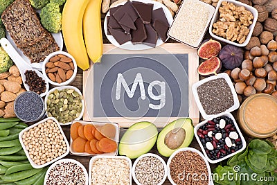 Magnesium food sources, top view on wooden background Stock Photo