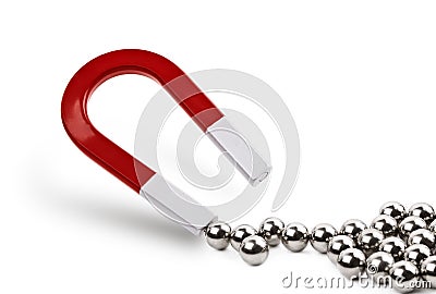 Magnet attracting chrome balls Stock Photo