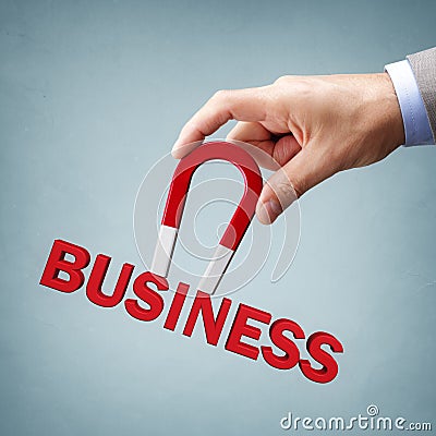 Magnet attracting new business clients and customers Stock Photo