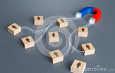 Magnet attracts magnetises certain people candidates blocks. Hiring highly qualified professional staff. Find best talent Stock Photo