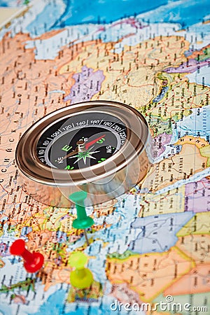 The magnetic compass and pins on a topographic map Stock Photo