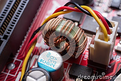 Magnetic Ferrite Core Detail on a red mother board Stock Photo