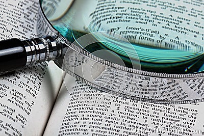 Magnifer and dictionary Stock Photo