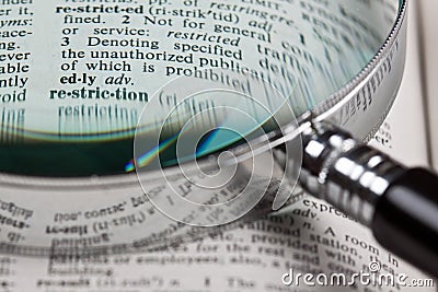 Magnifer and dictionary Stock Photo