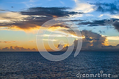 Magnificent evening sky over Pacific Ocean. Sunset behind clouds. Stock Photo