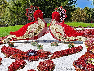 Magnificent sculpture in the park in the form of two birds looking at each other made of bright colors Editorial Stock Photo