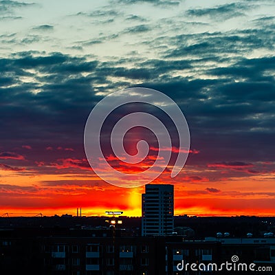 Magnificent shot of a sky and a city during the sunset Stock Photo