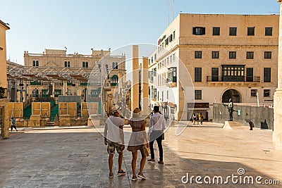 Malta, Valletta, August 2019. Tourists in the square near the theater ruins. Editorial Stock Photo