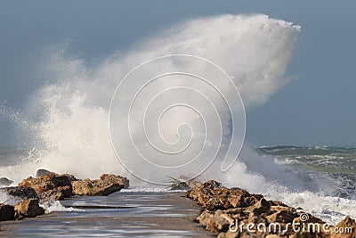 Magnificent wave crashes on North Jetty in Venice, Florida Stock Photo