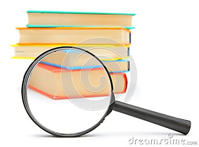 Magnifier and books. Stock Photo