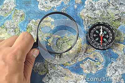 Magnifier,compass and map Stock Photo
