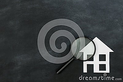 Magnifier searching house isolated on chalkboard Stock Photo