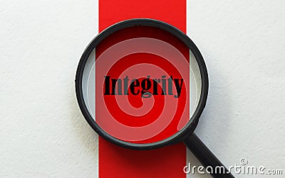 Magnifier with text Integrity on the white and red background Stock Photo