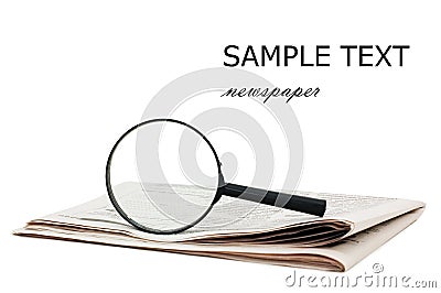Magnify glass over a of newspaper Stock Photo