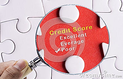 Magnifying glass focusing on poor credit score evaluation form Stock Photo