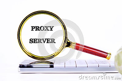 A magnifying glass highlights the term proxy server next to a calculator, symbolizing its importance in technology and Stock Photo