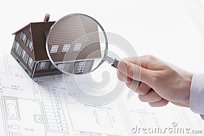 Magnifying glass and house. Stock Photo