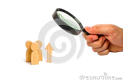 Magnifying glass is looking at a group of people and an up arrow. Increase and growth, static data. Level up. Improving quality of Stock Photo