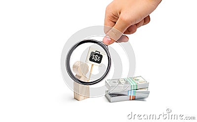 Magnifying glass is looking at the man figurine with a poster agitates near a pile of money. finding a better paid job. Financial Stock Photo