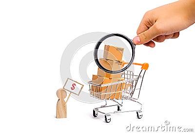 Magnifying glass is looking at a man with a poster sells goods. concept of commerce and trade, the sale and purchase of products Stock Photo