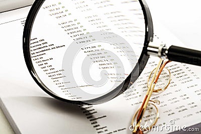 magnifying glass and quotations sheet. Stock Photo