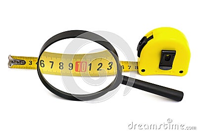 Magnifying glass and tapeline Stock Photo