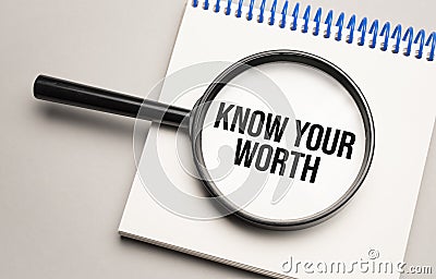 Magnifying glass with the word Know Your Worth on chart background Stock Photo