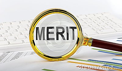Magnifying glass with the word MERIT on the chart background Stock Photo