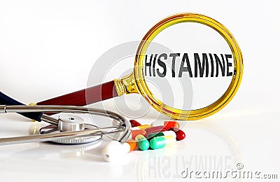 Magnifying lens with text HISTAMINE with medical tools Stock Photo