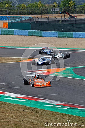 The F1 pack at the chicane during French Historic Grand Prix Editorial Stock Photo