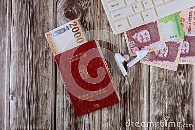 Magyar passport and computer keyboard with forint different mixed banknotes Stock Photo