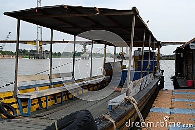 MAHAKAM/INDONESIA - FEBRUARY 8, 2016: Indonesian traditional wooden boat used for transporting passenger to cross Mahakam river in Editorial Stock Photo