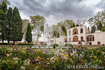 Mahan, Iran - 04.09.2019: Wide, long angle shot of water fountain in front of main building in Shahzadeh Mahan Historical Garden. Editorial Stock Photo