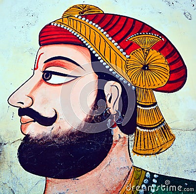 Maharaja in colorful costume in the wall of street of Udaipur Editorial Stock Photo