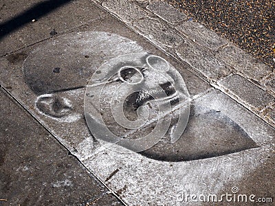 London, England - September 29 2015 : Mahatma Ghandi chalk drawing on the pavement floor at Camden Market London Editorial Stock Photo