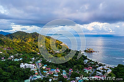 Mahe Island with Port Glaud village drone landscape, with lush tropical forest, Seychelles. Stock Photo