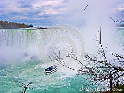 Maid of the mist : traveller boat travelling into Niangara Falls, Canada side (Horseshoe falls) Stock Photo