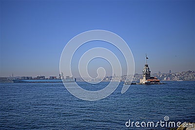 Maiden`s Tower and a big tanker crossing the Bosphorus Stock Photo