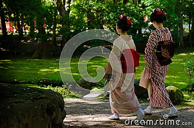 Maiko girls and Japanese garden, Kyoto Japan Editorial Stock Photo
